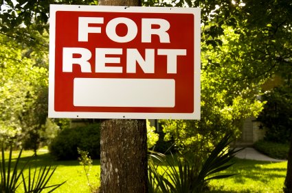 For Rent sign in front of a house.
